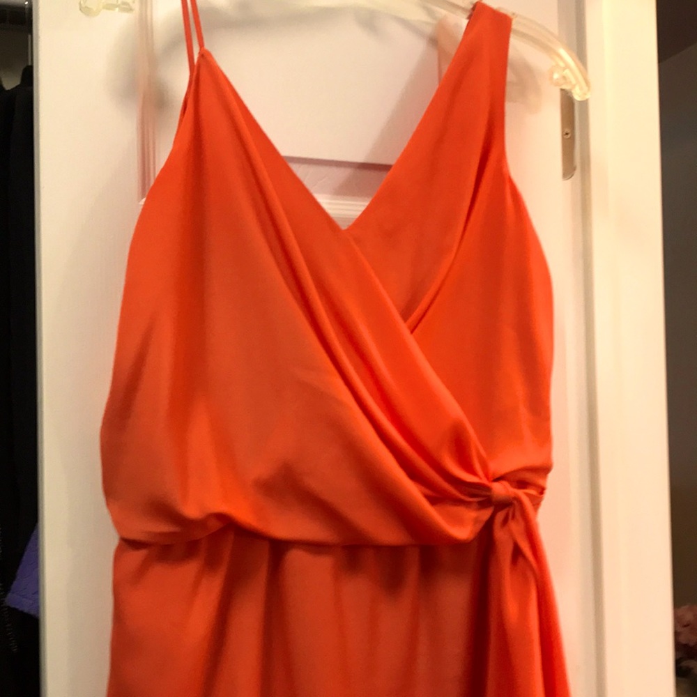 Orange silky dress.